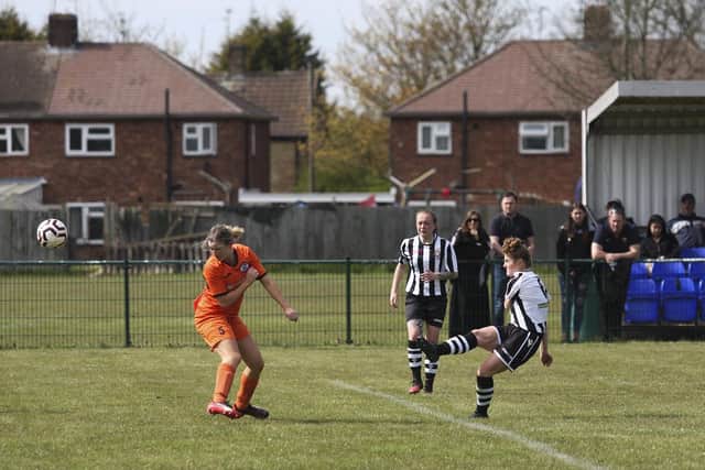 Alexa Hunter (stripes) in action for Peterborough Northern Star Reserves v St Ives. Photo: Tim Symonds.