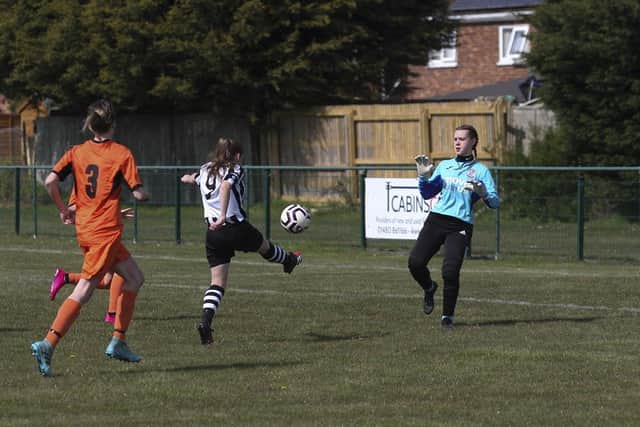 Georgia Clarke scores for Peterborough Northern Star Reserves against St Ives. Photo: Tim Symonds.