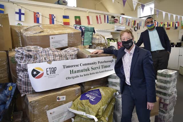 MP for Peterborough Paul Bristow at Unity Hall  with  Celso Oliveira, chairman of the  Timorese Community in Peterborough with goods   being sent overseas to ease the disaster in Timor.