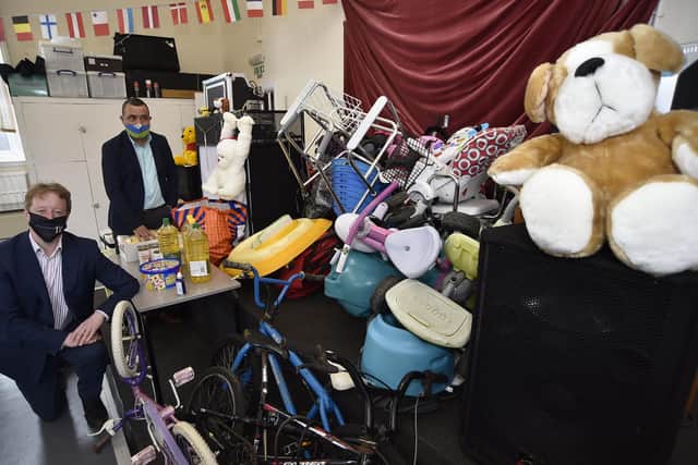MP for Peterborough Paul Bristow at Unity Hall with Celso Oliveira, chairman of the Timorese Community in Peterborough with goods being sent overseas to ease the disaster in Timor.