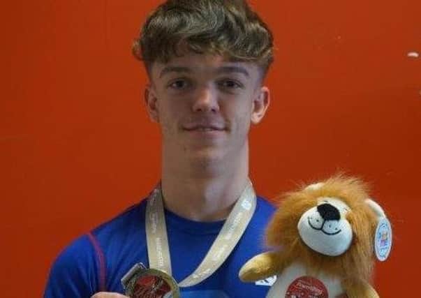 Tommy Smith with his gold medal.