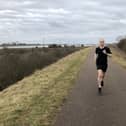 Lee Whitton running to help tackle climate change.