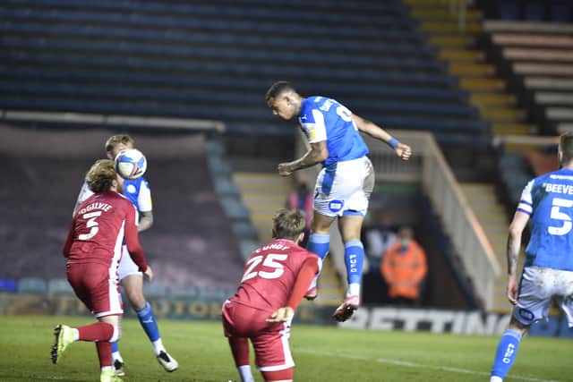 Posh striker Jonson Clarke-Harris heads at the Gillingham goal. Photo: David Lowndes.