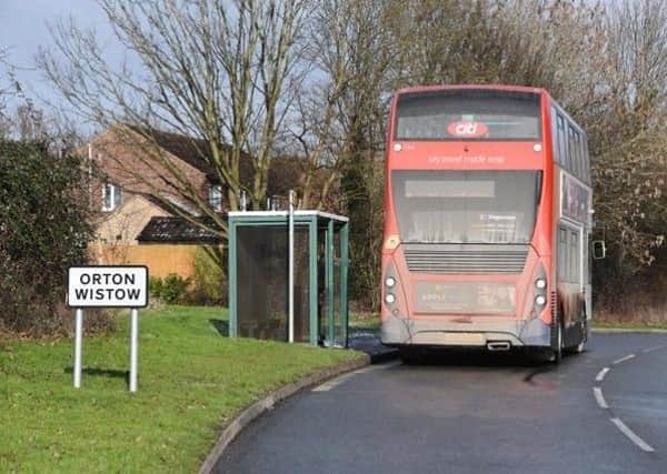 A bus stopped near Linnet in Orton Wistow.