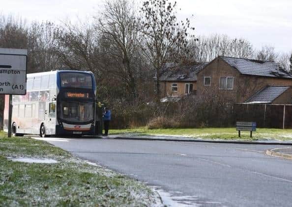A bus stopped near Linnet in Orton Wistow.
