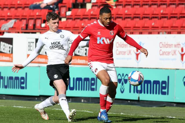 Harrison Burrows of Peterborough United puts pressure on Akin Famewo of Charlton Athletic. Photo: Joe Dent/theposh.com.