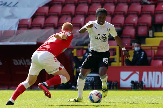 Siriki Dembele of Peterborough United takes on Ben Watson of Charlton Athletic. Photo: Joe Dent/theposh.com.