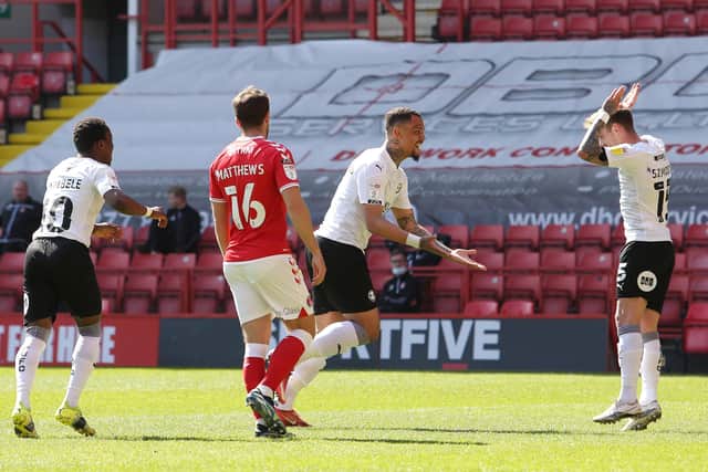 Jonson Clarke-Harris (left) celebrates his goal for Posh at Charlton with Sammie Szmodics. Photo: Joe Dent/theposh.com.
