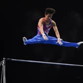 Jake Jarman competes in the high bar competition during the Men's all-around final of the 2021 European Artistic Gymnastics Championships at the St Jakobshalle, in Basel. (Photo by FABRICE COFFRINI/AFP via Getty Images).