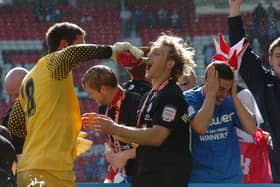 Paul Jones (left) and Craig Mackail-Smith celebrate the League One play-off final win at Old Trafford in 2011.