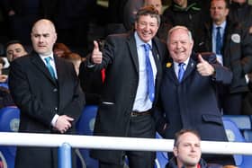 Peterborough United Co-owner Dr Jason Neale (centre) in the stands with Director of Football Barry Fry.