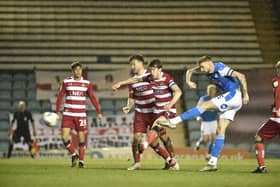 This volley from Posh skipper Mark Beevers was well saved by Doncaster 'keeper Louis Jones. Photo: David Lowndes.