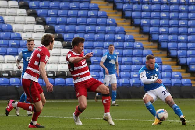 Joe Ward of Peterborough United scores the opening goal of the game against Doncaster Rovers. Photo: Joe Dent/theposh.com
