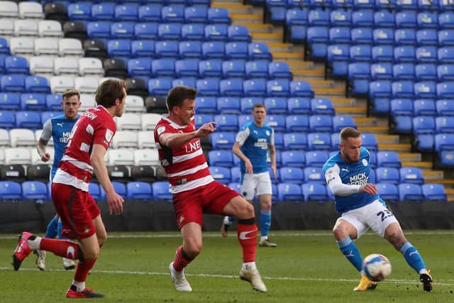 Joe Ward of Peterborough United scores the opening goal of the game against Doncaster Rovers. Photo: Joe Dent/theposh.com