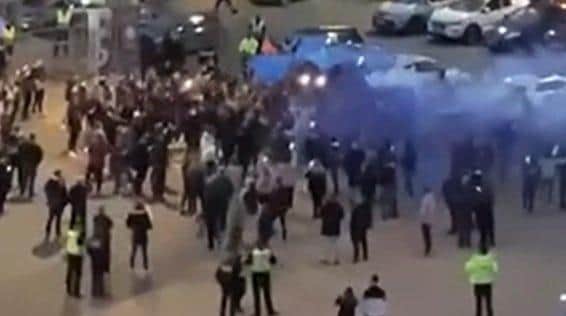 Fans let off flares outside the stadium last night. Pic and video: Sophie Wood