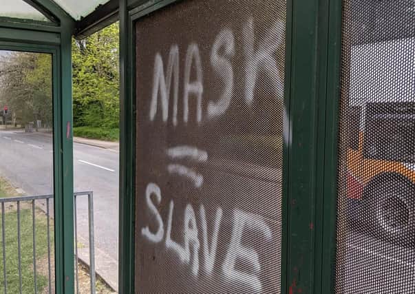 Graffiti on a bus stop in Orton Longueville.