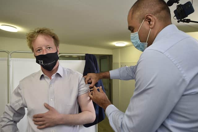 MP for Peterborough Paul Bristow gets his first Covid 19 jab from Dr Neil Modha at the Thistlemoor Medical Centre. EMN-210429-155916009
