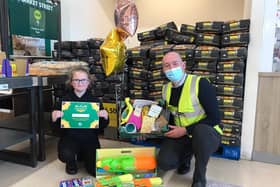 Megan Butler, 11, and Morrisons Store Manager Ben Daley. EMN-210430-155549001
