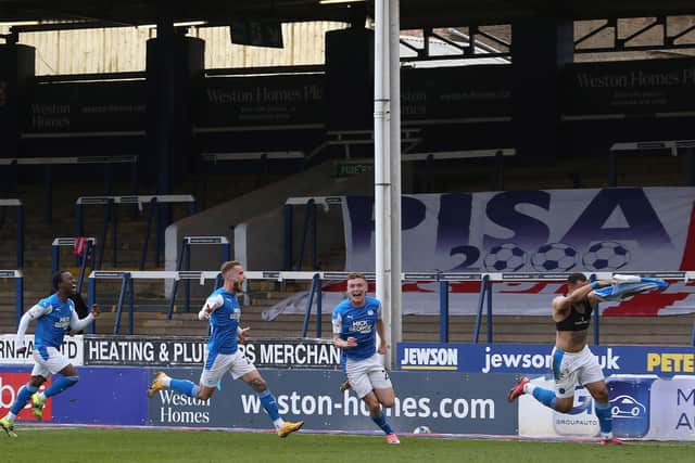 Jonson Clarke-Harris of Peterborough United celebrates scoring the goal that earns Peterborough United promotion to Sky Bet Championship. Photo: Joe Dent/theposh.com.