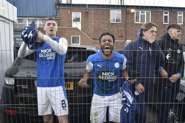 Posh stars Nathan Thompson (right) and Jack Taylor celebrate promotion to the Championship. Photo: David Lowndes.