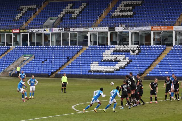 Jonson Clarke-Harris of Peterborough United scores direct from a free-kick against Lincoln. Photo: Joe Dent/theposh.com.