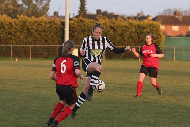 Jess Evans (stripes) in action for Peterborough Northern Star Reserves against Netherton. Photo: Tim Symonds.