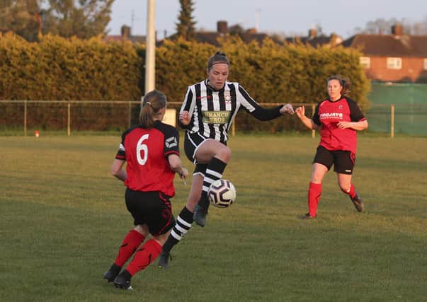Jess Evans (stripes) in action for Peterborough Northern Star Reserves against Netherton. Photo: Tim Symonds.