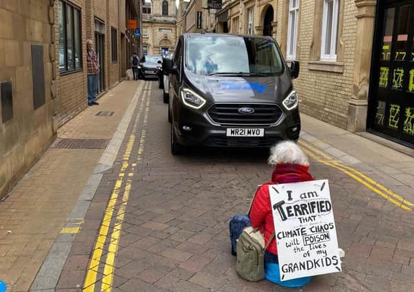 Lorna (72) during her protest on Cowgate on Saturday (May 1).