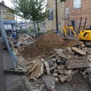 The flower bed next to the Palmerston Arms being demolished EMN-210505-145439009