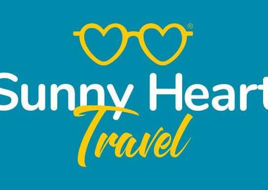 The logo for Sunny Heart Travel.