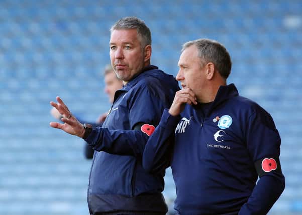 Posh assistant manager Mark Robson (right) with first-team boss Darren Ferguson.