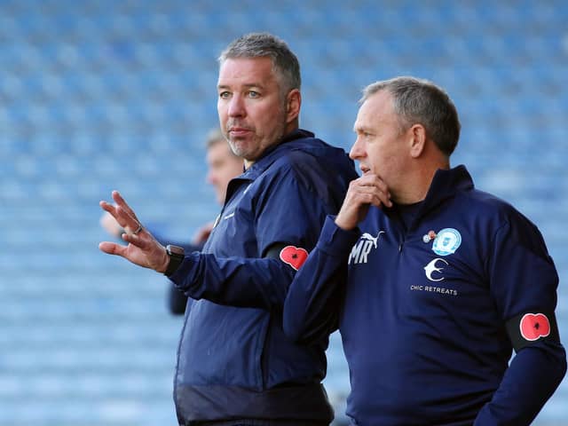 Posh assistant manager Mark Robson (right) with first-team boss Darren Ferguson.