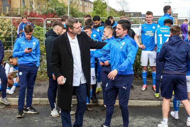 Posh co-owner Darragh MacAnthony with goalkeeper Christy Pym after promotion was secured. Photo: Joe Dent/theposh.com.