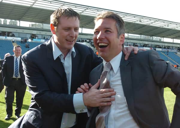 Darragh MacAnthony and Darren Ferguson celebrate a Posh promotion from League One in 2009.