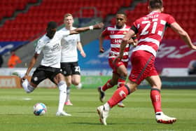 Mo Eisa of Peterborough United scores the opening goal of the game against Doncaster Rovers. Photo Joe Dent/theposh.com.