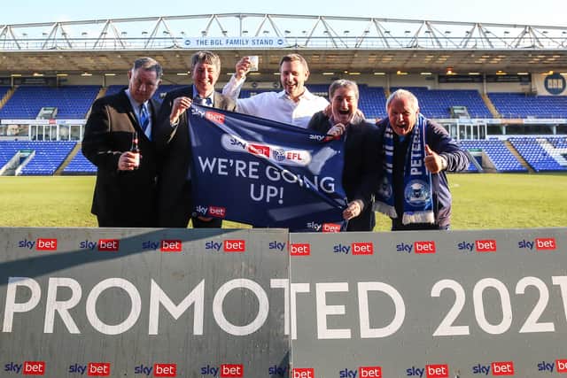 Poosh officials and owners celebrate promotion, from left, Bob Symns (chief executive officer), Dr Jason Neale (co-owner), Darragh MacAnthony (co-owner), Stewart Thompson)(co-owner) and Barry Fry (director of football). Photo: Joe Dent/theposh.com.