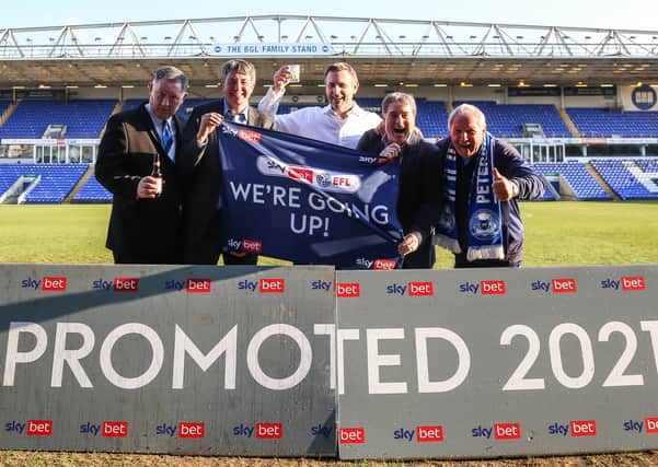 Poosh officials and owners celebrate promotion, from left, Bob Symns (chief executive officer), Dr Jason Neale (co-owner), Darragh MacAnthony (co-owner), Stewart Thompson)(co-owner) and Barry Fry (director of football). Photo: Joe Dent/theposh.com.