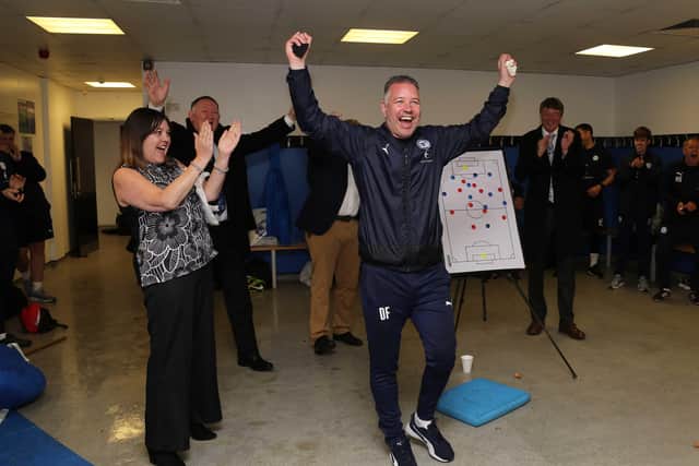 Posh boss Darren Ferguson celebrates a great season in the Doncaster Rovers dressing room after the final match. Photo: Joe Dent/theposh.com.