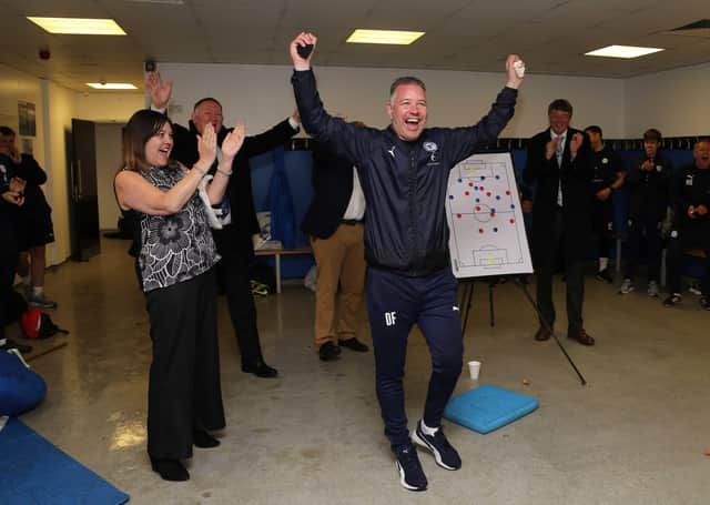 Posh boss Darren Ferguson celebrates a great season in the Doncaster Rovers dressing room after the final match. Photo: Joe Dent/theposh.com.