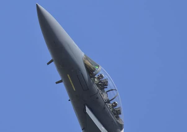 A F-15E Strike Eagle of RAF Lakenheath's 48th Fighter Wing climbs into the blue
(USAF photo by SA Trevor McBride) ANL-151125-100633001