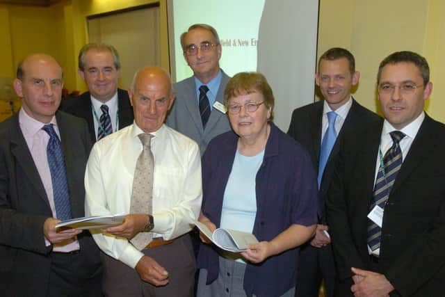 John Holdich (back, centre) at the launch of an action report for the Millfield area