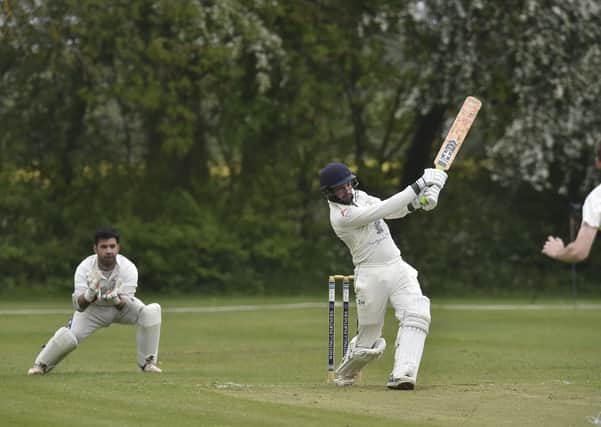 Castor captain Reece Smith hits out during his side's win over Huntingdon in Cambs Division Two. Photo: David Lowndes.