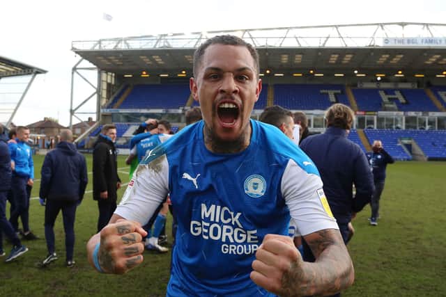 Posh striker Jonson Clarke-Harris celebrates promotion.