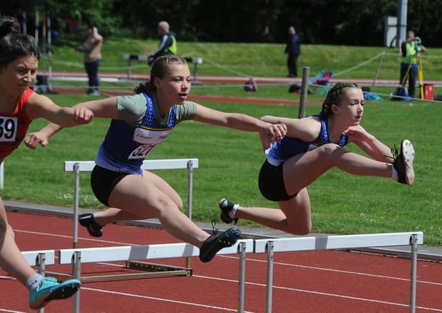Peterborough and Nene Valley Athletic Club pair Pearl Ford and Sienna Slater in action in the under 13 girls hurdles at the Embankment. Photo: David Lowndes.