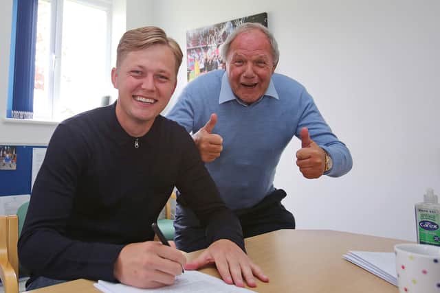 Frankie Kent signs his new Posh contract in the presence of a very happy Barry Fry. Photo: Joe Dent/theposh.com.