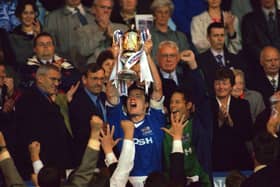 Mark Tyler (right, centre) watches on as Posh skipper Andy Edwards holds aloft the Third Division play-off final trophy at Wembley in May, 2000. Edwards was named in Tyler's all-star team.