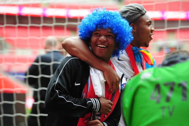 Posh pair Britt Assombalonga (right) and Mark Little celebrate the 2014 Johnstone's Paint Trophy Final success over Chesterfield at Wembley.