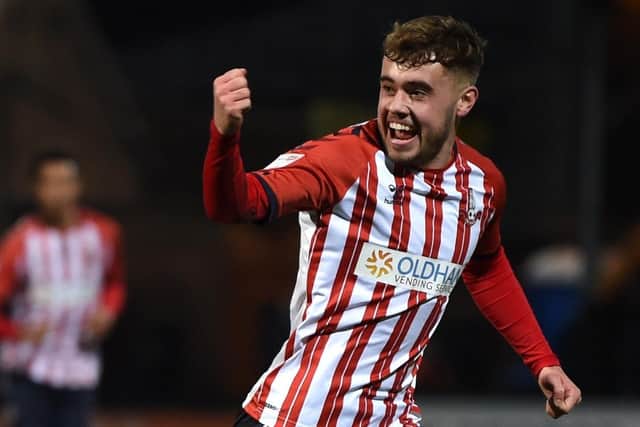 Alfie McCalmont after scoring for Oldham at Cambridge last season. Photo: Joe Giddins PA Wire