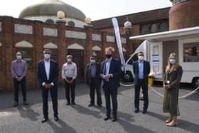 MP for Peterborough Paul Bristow with volunteers at the Burton Street mosque where a Covid-19 testing centre is operating EMN-210528-134613009