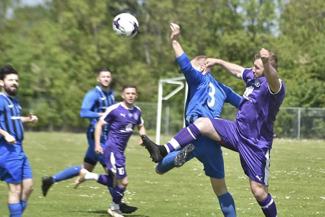 Action from Farcet v Stanground Sports (purple) at Stanground Academy. Photo: David Lowndes.